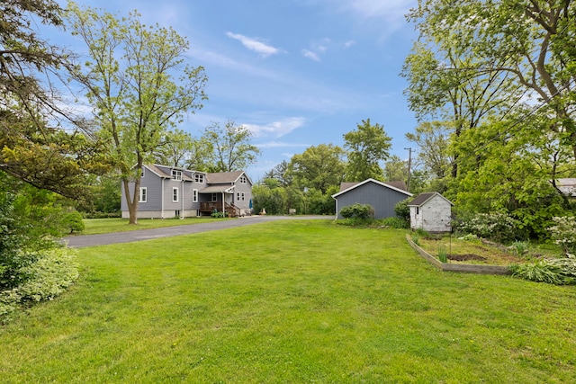 17811 Harwood Ave, Homewood, IL 60430 - view of green lawn featuring asphalt driveway