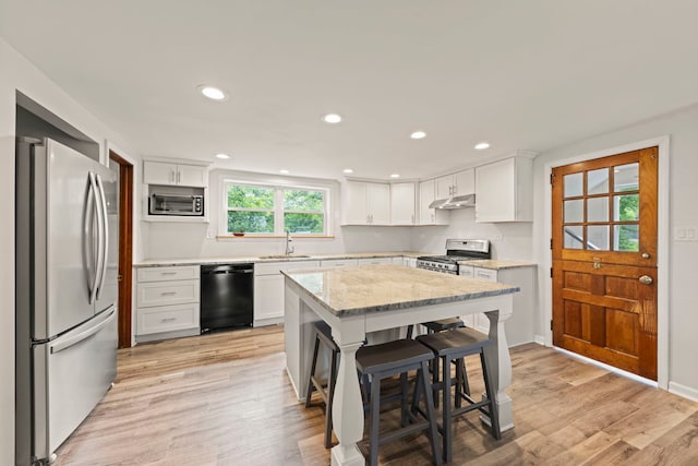 17811 Harwood Ave, Homewood, IL 60430 - kitchen with appliances with stainless steel finishes, under cabinet range hood, a sink, white cabinetry, and recessed lighting