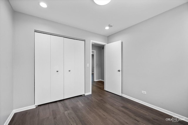 2724 Bluewater Cir, Naperville, IL 60564 - unfurnished bedroom with baseboards, dark wood-style floors, a closet, and recessed lighting