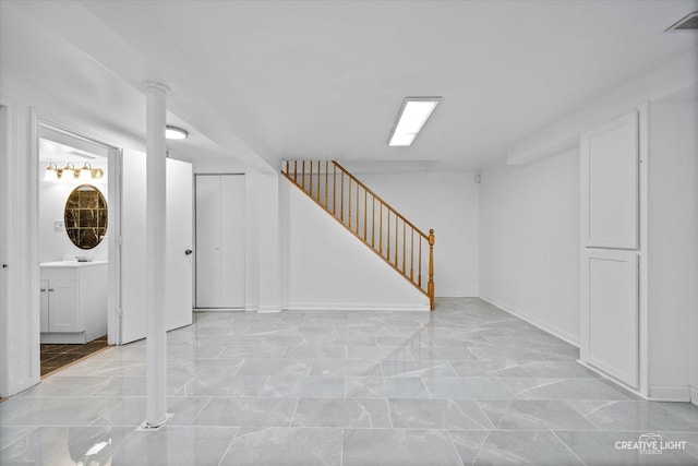 2724 Bluewater Cir, Naperville, IL 60564 - finished below grade area featuring stairway, light marble finish flooring, and baseboards