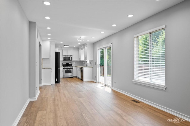 2724 Bluewater Cir, Naperville, IL 60564 - kitchen with stainless steel appliances, light countertops, white cabinetry, recessed lighting, and light wood-type flooring