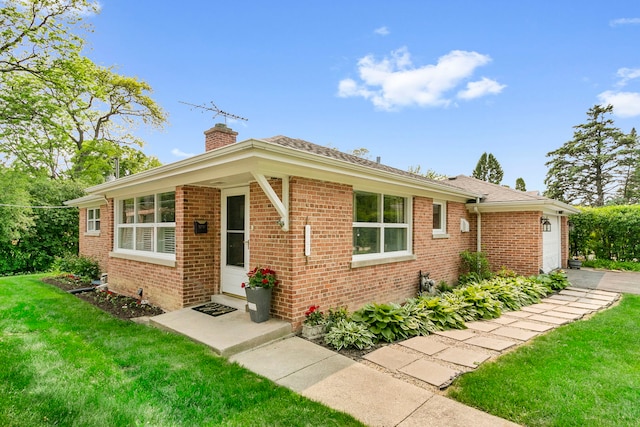 1717 Dundee Rd, Northbrook, IL 60062 - ranch-style house with a chimney, a front yard, brick siding, and a garage