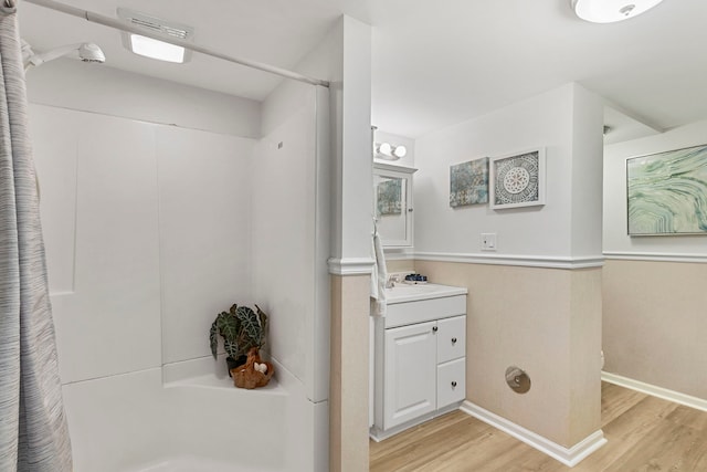 1717 Dundee Rd, Northbrook, IL 60062 - full bathroom featuring wood finished floors, vanity, a shower with curtain, and baseboards