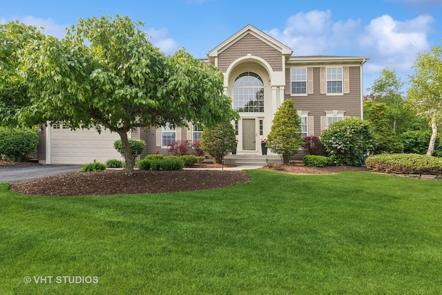 36932 N Fernview Ln, Lake Villa, IL 60046 - view of front facade with driveway, a front yard, and an attached garage