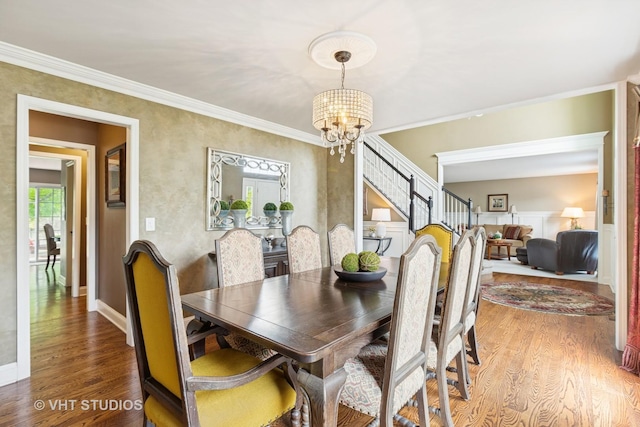 36932 N Fernview Ln, Lake Villa, IL 60046 - dining area featuring a chandelier, wood finished floors, ornamental molding, and baseboards