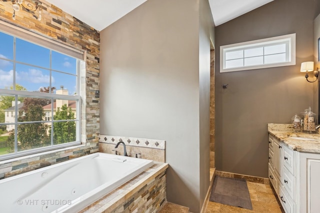 36932 N Fernview Ln, Lake Villa, IL 60046 - full bathroom with a whirlpool tub, vanity, healthy amount of natural light, and baseboards