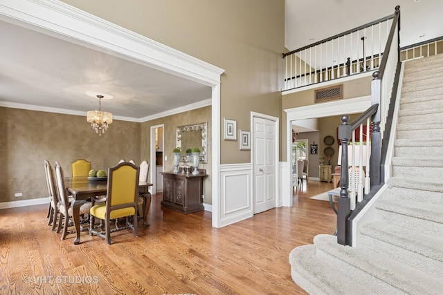 36932 N Fernview Ln, Lake Villa, IL 60046 - dining area featuring stairway, a chandelier, and light wood finished floors