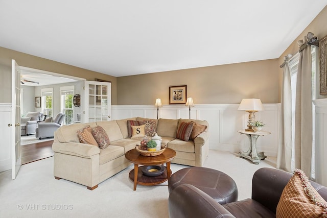 36932 N Fernview Ln, Lake Villa, IL 60046 - living area featuring wainscoting, a decorative wall, and light carpet