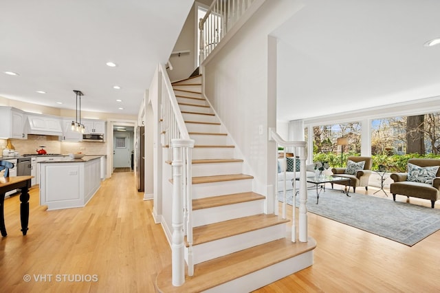 630 Juniper Rd, Glenview, IL 60025 - stairs featuring wood finished floors and recessed lighting