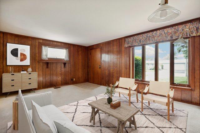 4612 W 89th Pl, Hometown, IL 60456 - living room with wood walls and light carpet