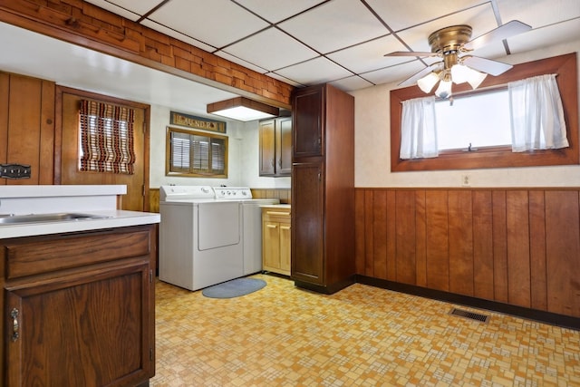 4612 W 89th Pl, Hometown, IL 60456 - washroom featuring washing machine and clothes dryer, cabinet space, light floors, a wainscoted wall, and wooden walls