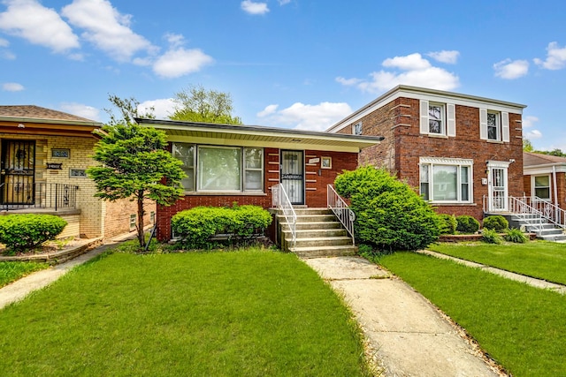 14209 S Stewart Ave, Riverdale, IL 60827 - view of front of home with a front lawn and brick siding