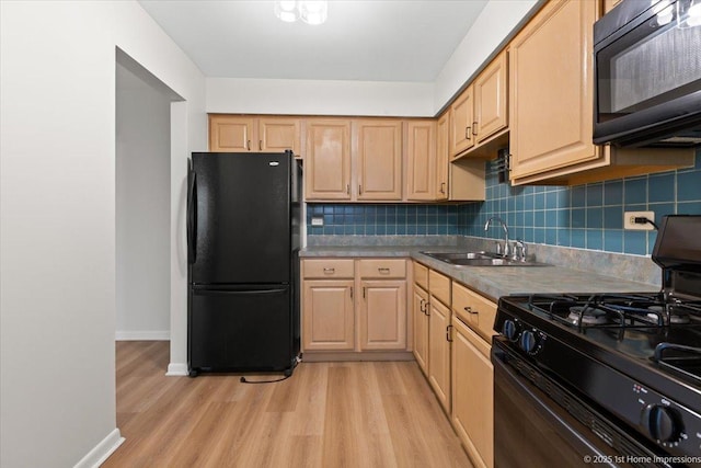 9745 S Karlov Ave Unit 608, Oak Lawn, IL 60453 - kitchen featuring black appliances, a sink, light brown cabinetry, and light wood finished floors