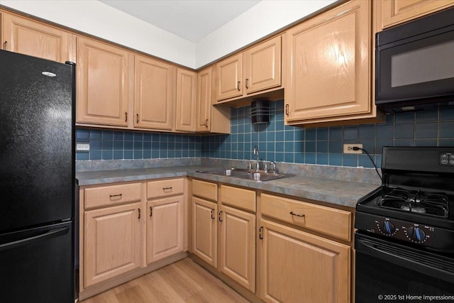 9745 S Karlov Ave Unit 608, Oak Lawn, IL 60453 - kitchen with black appliances, a sink, light brown cabinets, and light wood finished floors