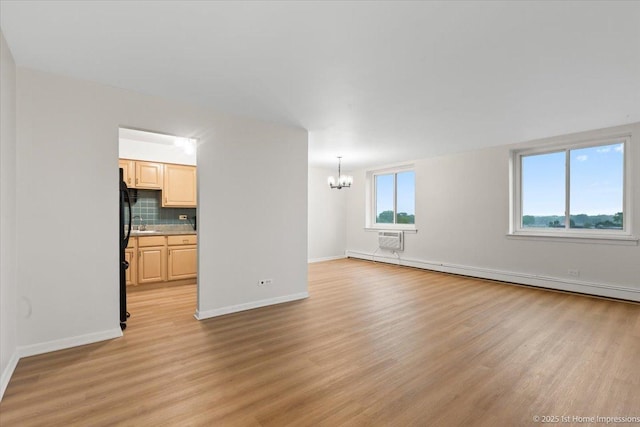 9745 S Karlov Ave Unit 608, Oak Lawn, IL 60453 - unfurnished living room with a chandelier, baseboard heating, light wood-type flooring, and a wall mounted air conditioner