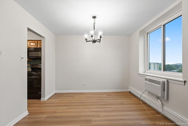 9745 S Karlov Ave Unit 608, Oak Lawn, IL 60453 - unfurnished dining area with a chandelier, light wood finished floors, a baseboard radiator, baseboards, and a wall mounted air conditioner