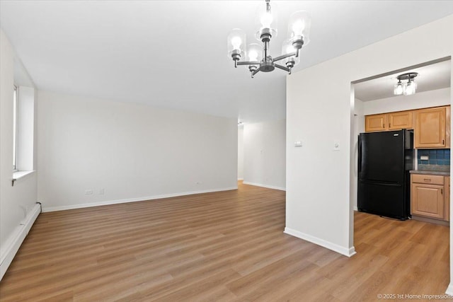 9745 S Karlov Ave Unit 608, Oak Lawn, IL 60453 - unfurnished dining area featuring a chandelier, baseboard heating, light wood-type flooring, and baseboards