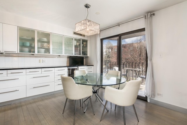 125 Boardwalk Pl Unit 101, Park Ridge, IL 60068 - dining space with a chandelier, wood finished floors, and wine cooler