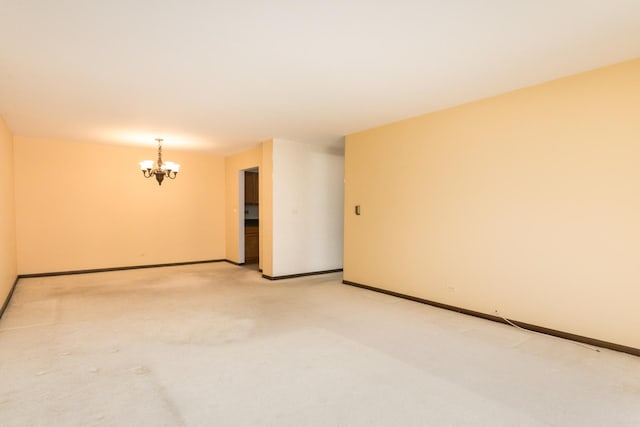 401 Ascot Dr Unit 1C, Park Ridge, IL 60068 - empty room featuring a chandelier and light colored carpet
