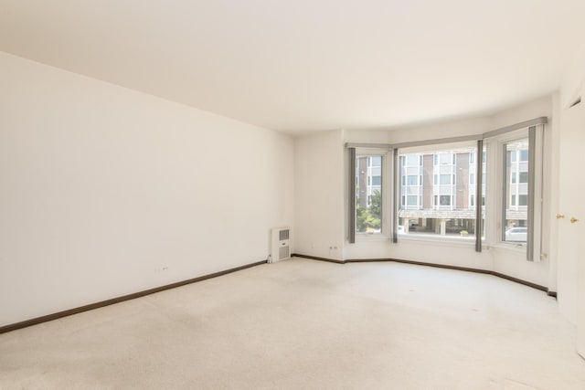 401 Ascot Dr Unit 1C, Park Ridge, IL 60068 - carpeted spare room featuring healthy amount of natural light and heating unit