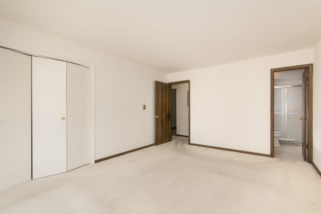 401 Ascot Dr Unit 1C, Park Ridge, IL 60068 - unfurnished bedroom featuring light colored carpet, ensuite bathroom, and a closet
