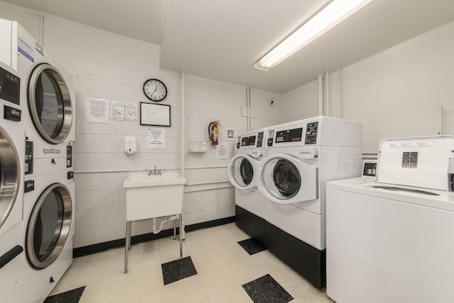 401 Ascot Dr Unit 1C, Park Ridge, IL 60068 - communal laundry room with separate washer and dryer, stacked washer / drying machine, concrete block wall, and light floors