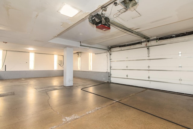 401 Ascot Dr Unit 1C, Park Ridge, IL 60068 - garage featuring concrete block wall and a garage door opener