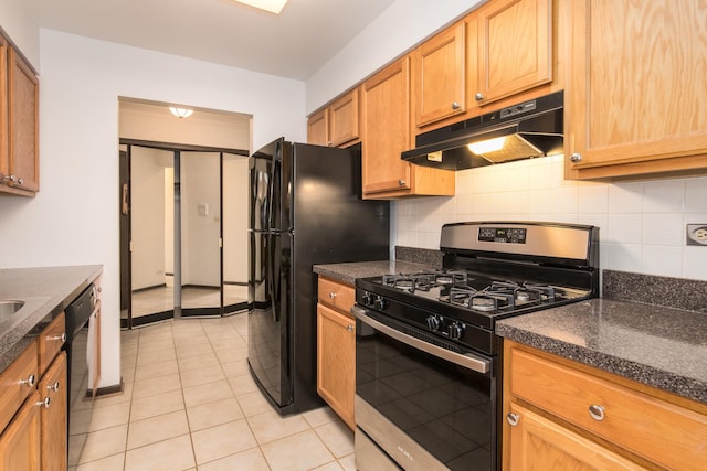 401 Ascot Dr Unit 1C, Park Ridge, IL 60068 - kitchen with black appliances, under cabinet range hood, dark countertops, and backsplash