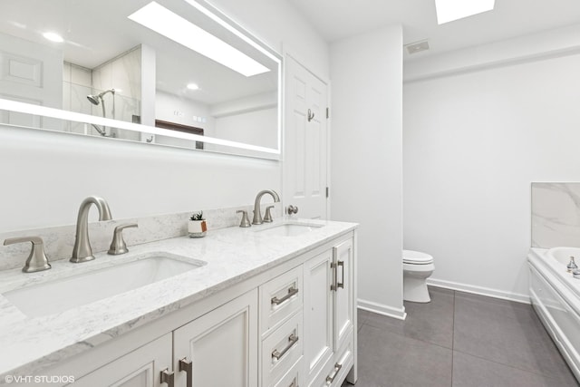 5844 N Hermitage Ave Unit A, Chicago, IL 60660 - bathroom featuring double vanity, toilet, tile patterned floors, a tub to relax in, and a shower