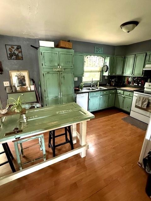 29478 E County Road 2390th Rd, Manito, IL 61546 - kitchen featuring green cabinets, white appliances, dark wood finished floors, and dark countertops