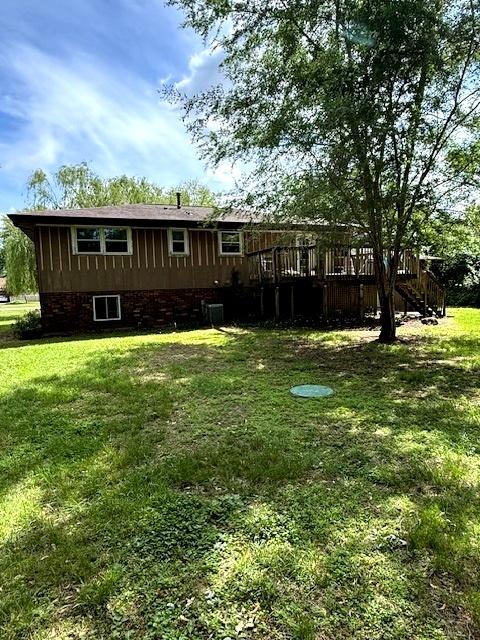 29478 E County Road 2390th Rd, Manito, IL 61546 - rear view of house featuring a lawn and a wooden deck