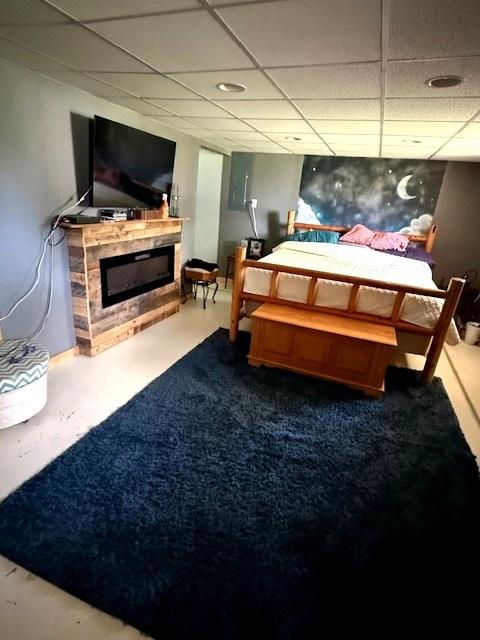 29478 E County Road 2390th Rd, Manito, IL 61546 - bedroom with a paneled ceiling and a glass covered fireplace