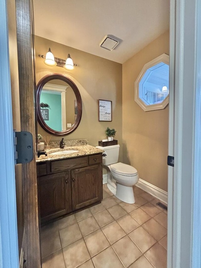 3838 Plainfield Rd, Oswego, IL 60543 - half bath featuring toilet, vanity, tile patterned flooring, and baseboards