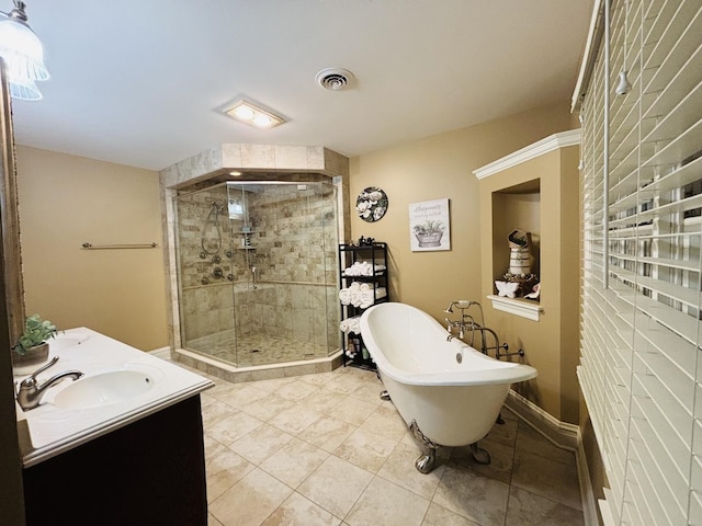 3838 Plainfield Rd, Oswego, IL 60543 - full bathroom featuring a shower stall, a freestanding bath, double vanity, and tile patterned floors