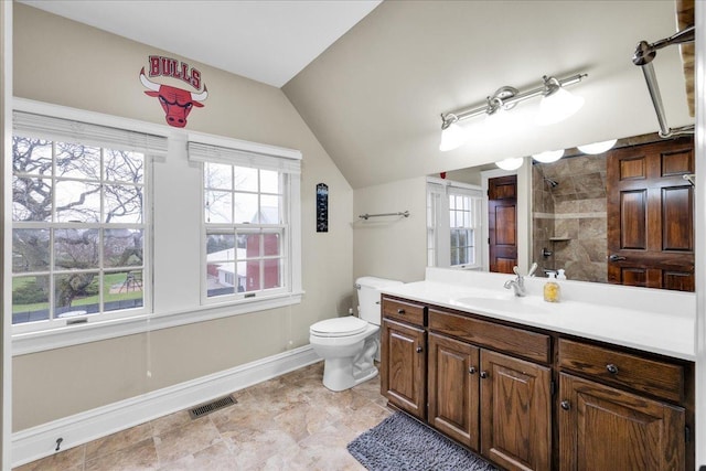 3838 Plainfield Rd, Oswego, IL 60543 - full bathroom with vanity, toilet, baseboards, a tile shower, and lofted ceiling