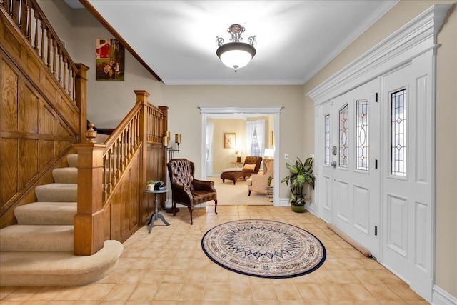 3838 Plainfield Rd, Oswego, IL 60543 - entrance foyer with stairway, crown molding, light tile patterned flooring, and baseboards