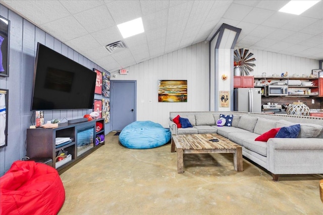 3838 Plainfield Rd, Oswego, IL 60543 - living room featuring concrete flooring and vaulted ceiling