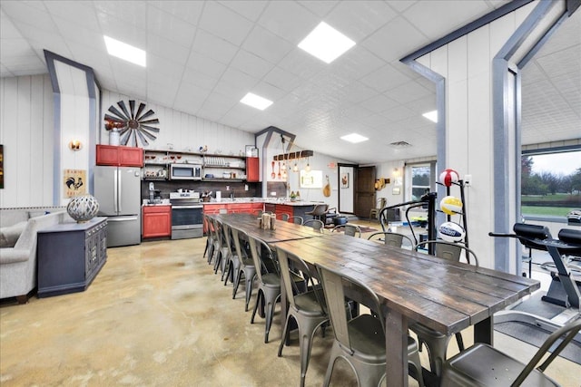 3838 Plainfield Rd, Oswego, IL 60543 - dining area with concrete floors, vaulted ceiling, and plenty of natural light