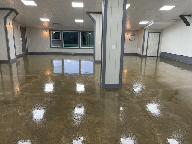3838 Plainfield Rd, Oswego, IL 60543 - spare room with finished concrete flooring, baseboards, and a drop ceiling
