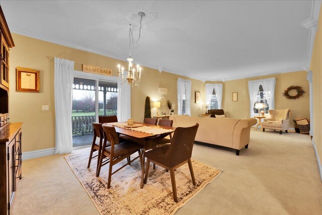 3838 Plainfield Rd, Oswego, IL 60543 - dining area featuring light colored carpet, crown molding, a chandelier, and baseboards