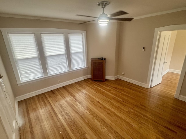 6638 S Greenwood Ave Unit 2B, Chicago, IL 60637 - unfurnished room with light wood-style floors, crown molding, baseboards, and ceiling fan