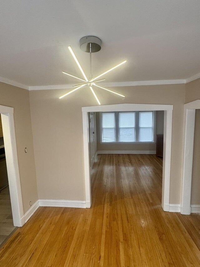 6638 S Greenwood Ave Unit 2B, Chicago, IL 60637 - empty room with baseboards, ornamental molding, and light wood-type flooring