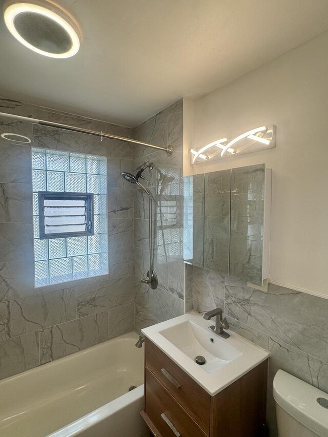 6638 S Greenwood Ave Unit 2B, Chicago, IL 60637 - bathroom with tile walls, bathtub / shower combination, vanity, toilet, and a chandelier