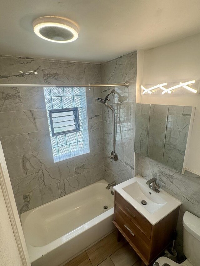 6638 S Greenwood Ave Unit 2B, Chicago, IL 60637 - bathroom with shower / washtub combination, tile walls, vanity, and toilet