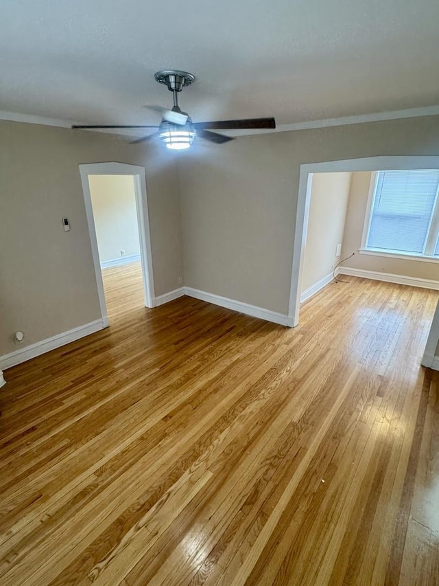 6638 S Greenwood Ave Unit 2B, Chicago, IL 60637 - spare room featuring light wood-type flooring, baseboards, ceiling fan, and ornamental molding