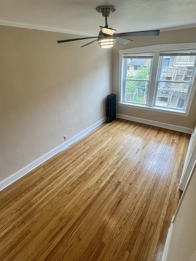6638 S Greenwood Ave Unit 2B, Chicago, IL 60637 - empty room featuring baseboards, light wood finished floors, ceiling fan, and crown molding