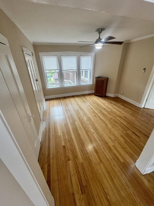 6638 S Greenwood Ave Unit 2B, Chicago, IL 60637 - unfurnished living room featuring light wood-type flooring, baseboards, a ceiling fan, and ornamental molding