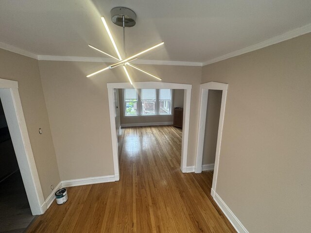 6638 S Greenwood Ave Unit 2B, Chicago, IL 60637 - corridor featuring wood finished floors, baseboards, crown molding, and a chandelier