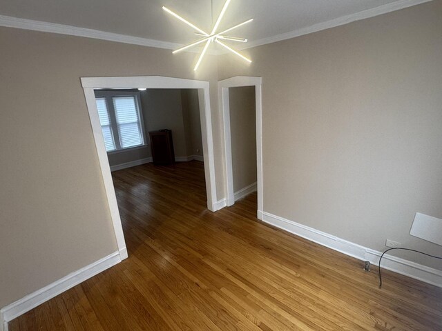 6638 S Greenwood Ave Unit 2B, Chicago, IL 60637 - spare room featuring wood finished floors, ornamental molding, and baseboards