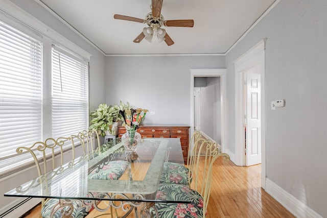 1418 S Cicero Ave, Cicero, IL 60804 - dining area with baseboards, ceiling fan, light wood-style floors, and ornamental molding